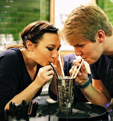 guy and girl sharing a milkshake