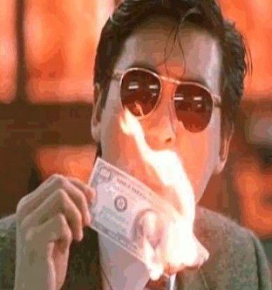 Man smoking and burning money